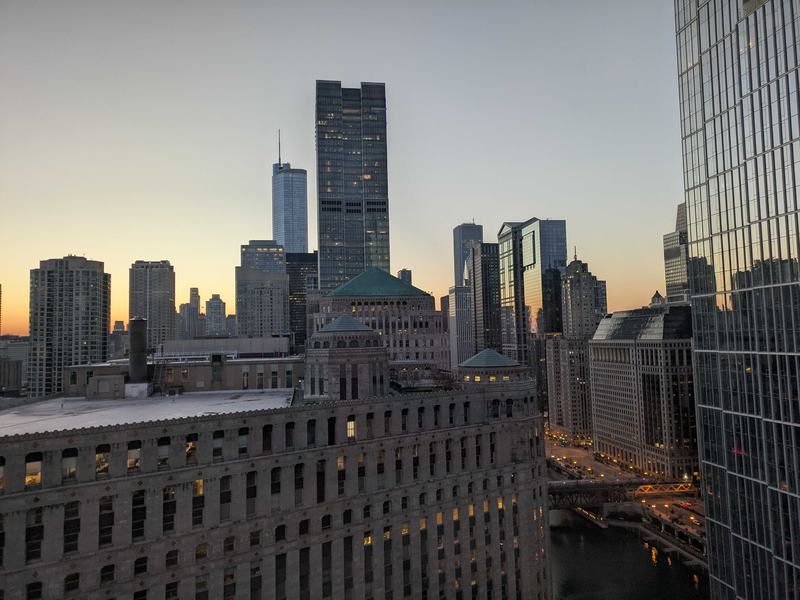 The sun rising over an east-facing view of the Chicago skyline early in the morning.