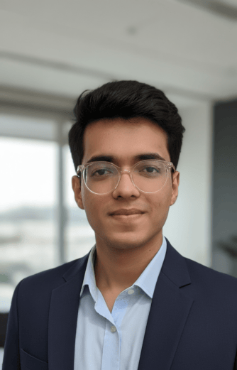 A headshot of Aryan Khandhadiya smiling
