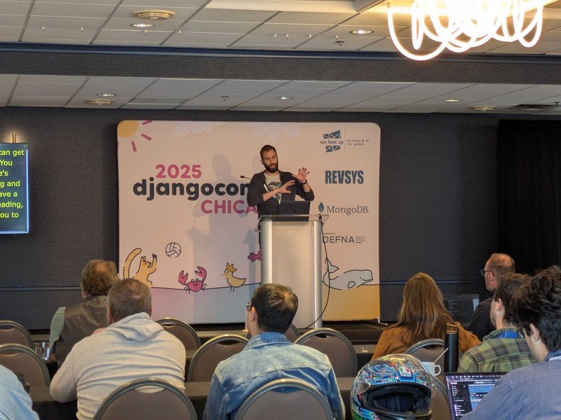 Michael Trythall is up on stage in front of a full audience gesturing at a slide as he describes some good approaches to building a great Wagtail architecture.