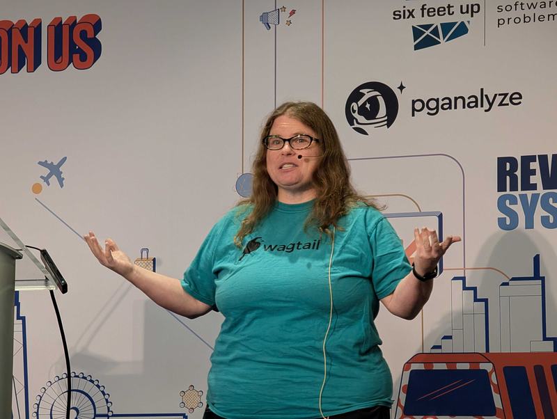 Meagen speaking on the main stage of DjangoCon US 2026 in her green Wagtail t-shirt.
