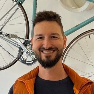 A smiling picture of Alex Morega