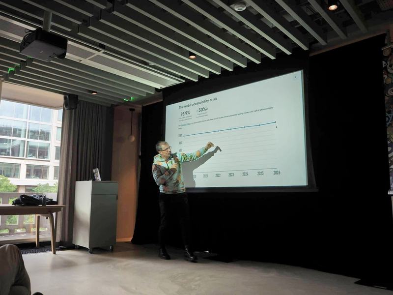 Presenter gesturing toward a simple timeline slide during a Wagtail Space session