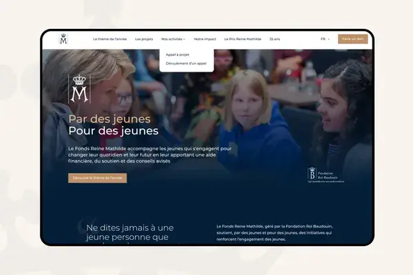 Screenshot of a website in French tor the Queen Mathilde Fund. There is a hero image with a photo of smiling children in it.